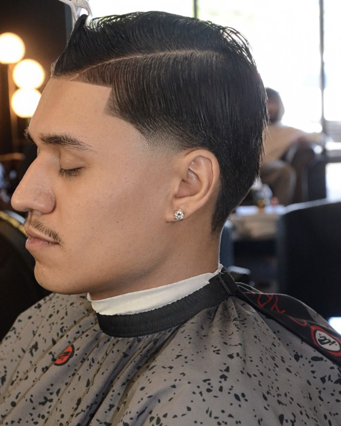 Mid fade with curls on top